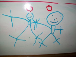 100_0636 Zander drew this on our white board. He says its Mommy and Zander holding hands.