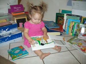 100_06811 Lexi, 18 months, enjoying the touch & feel books
