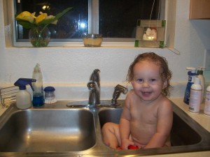 100_1009 Lexi getting a bath in the sink.