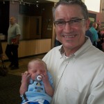 100_1719 Pastor Owens holding Aiden