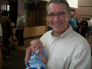 Pastor Owens holding Aiden